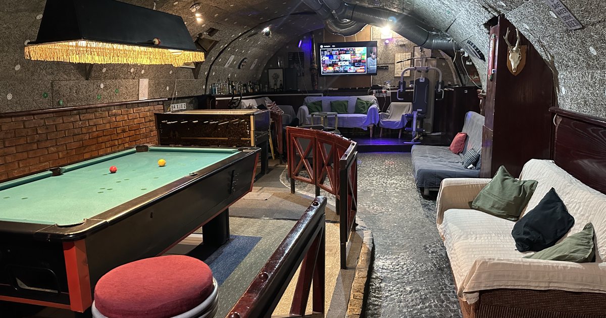 Pool table and lounge inside a Whole Basement Former Pub venue in Budapest